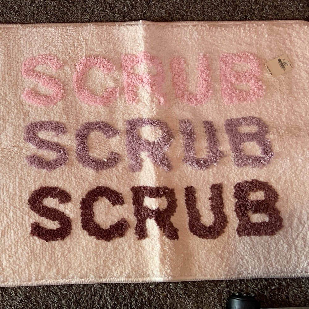 Pink Victoria’s Secret bath mat